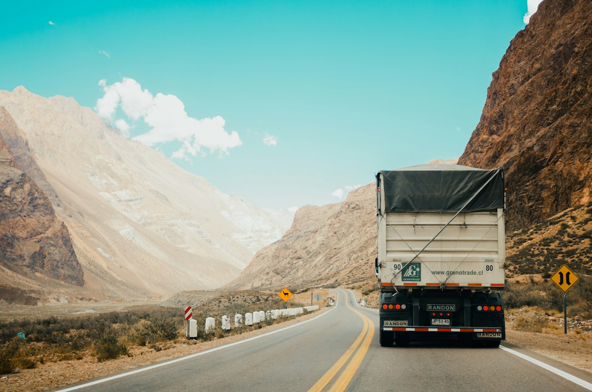 Semi truck on US highway at sunset